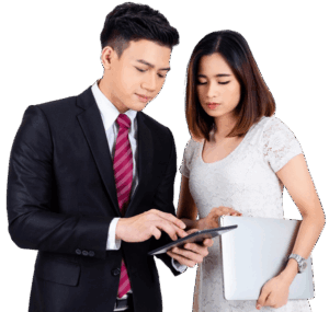 Two legal professionals standing together and reviewing a document